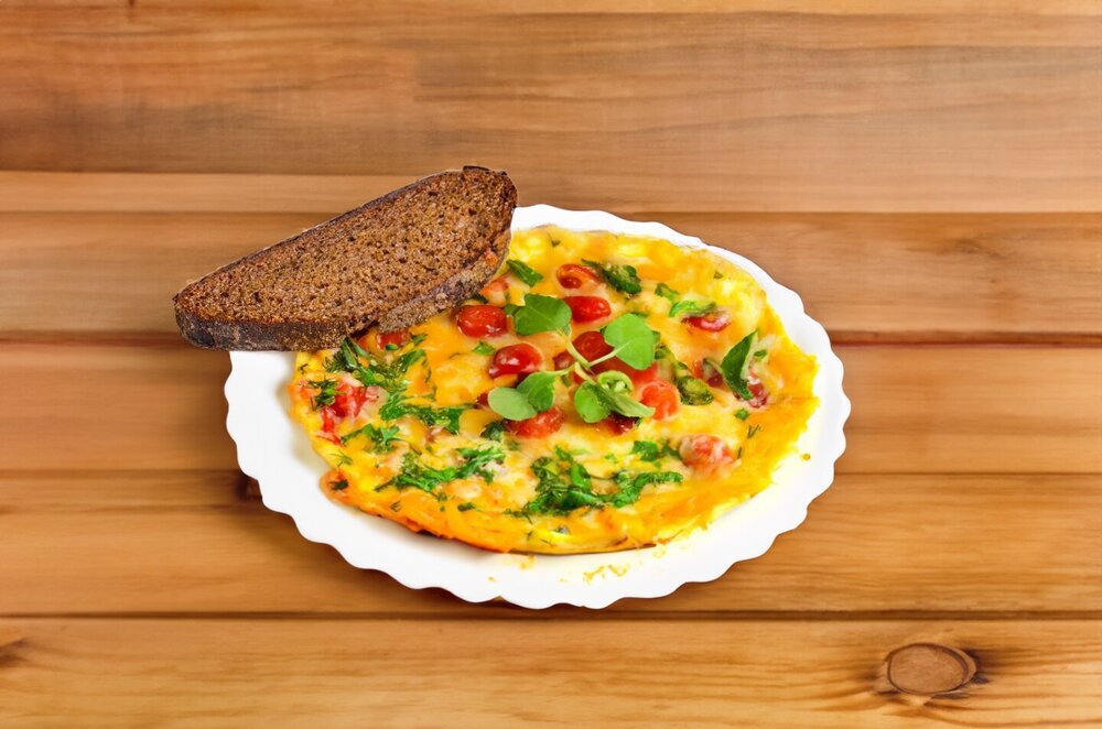 Tomatoes with Cheese, Onion, and Egg in a Skillet