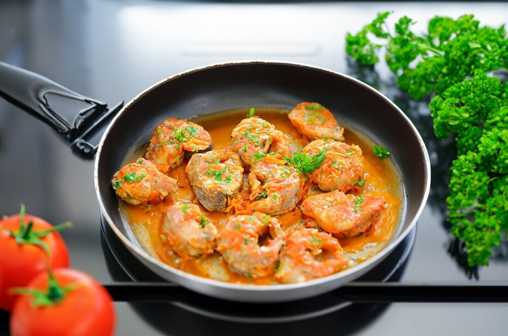 Fish with Carrots and Onions in a Skillet